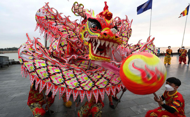 Winter Olympics host China welcomes Year of Tiger with quiet celebrations amid COVID outbreaks