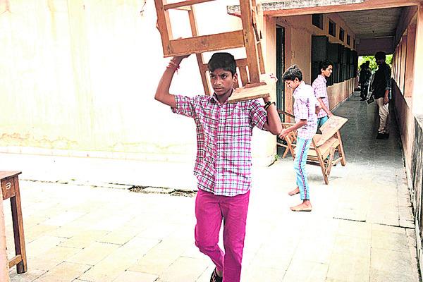 Students carrying chairs for teachers, Struggling Students, Teachers' Training Approach