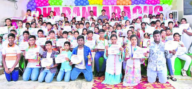 Students awarded for excellence in district-level Abacus contests, Chief Guests with the talented students, Abacus competition winners receiving gold, silver, and bronze medals,