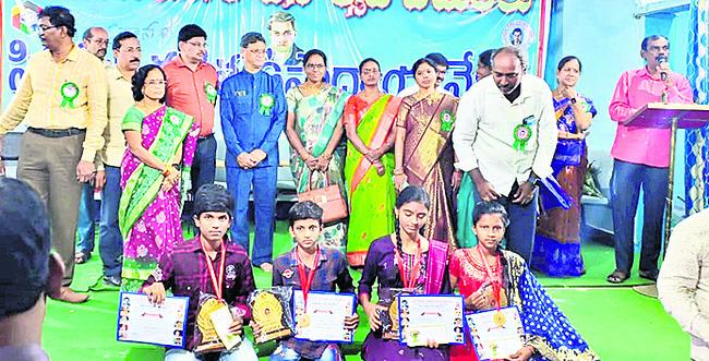 Higher position in life if you excel in mathematics   Students receiving awards at the National Mathematics Day event in Srikakulam District Center.