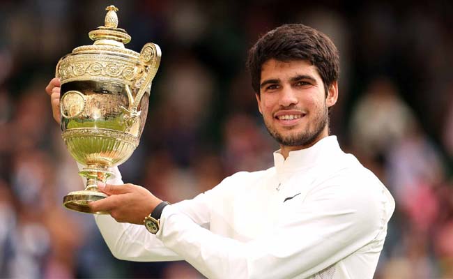 Dominant Carlos Alcaraz blows away Novak Djokovic to retain title  Carlos Alcaraz, Wimbledon Men's Singles Champion  Carlos Alcaraz with Wimbledon Trophy  