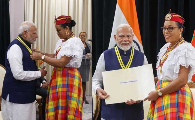 PM Modi conferred with Dominica’s highest National Award  Prime Minister Modi receiving the Dominica Award of Honour from President Silvani Burton  