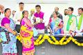 Free coaching for DSC Tribal candidates Gurram Joshua speaking at the World Adivasi Day event organized by the District Tribal Welfare Department  District Collector P. Arun Babu addressing the 150 tribal students about the DSC examination and free training opportunities  