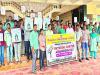 Dr. Nazir Shaikh speaking at National Cancer Awareness Day in Bapatla Engineering College. Students promoting cancer awareness. Students need awareness about cancer, Creating awareness about cancer disease. 