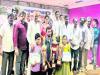 Chess winners receiving prizes from MP Umabala