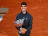 Carlos Alcaraz wins French Open for third Grand Slam title  Carlos Alcaraz lifting the French Open trophy in celebration